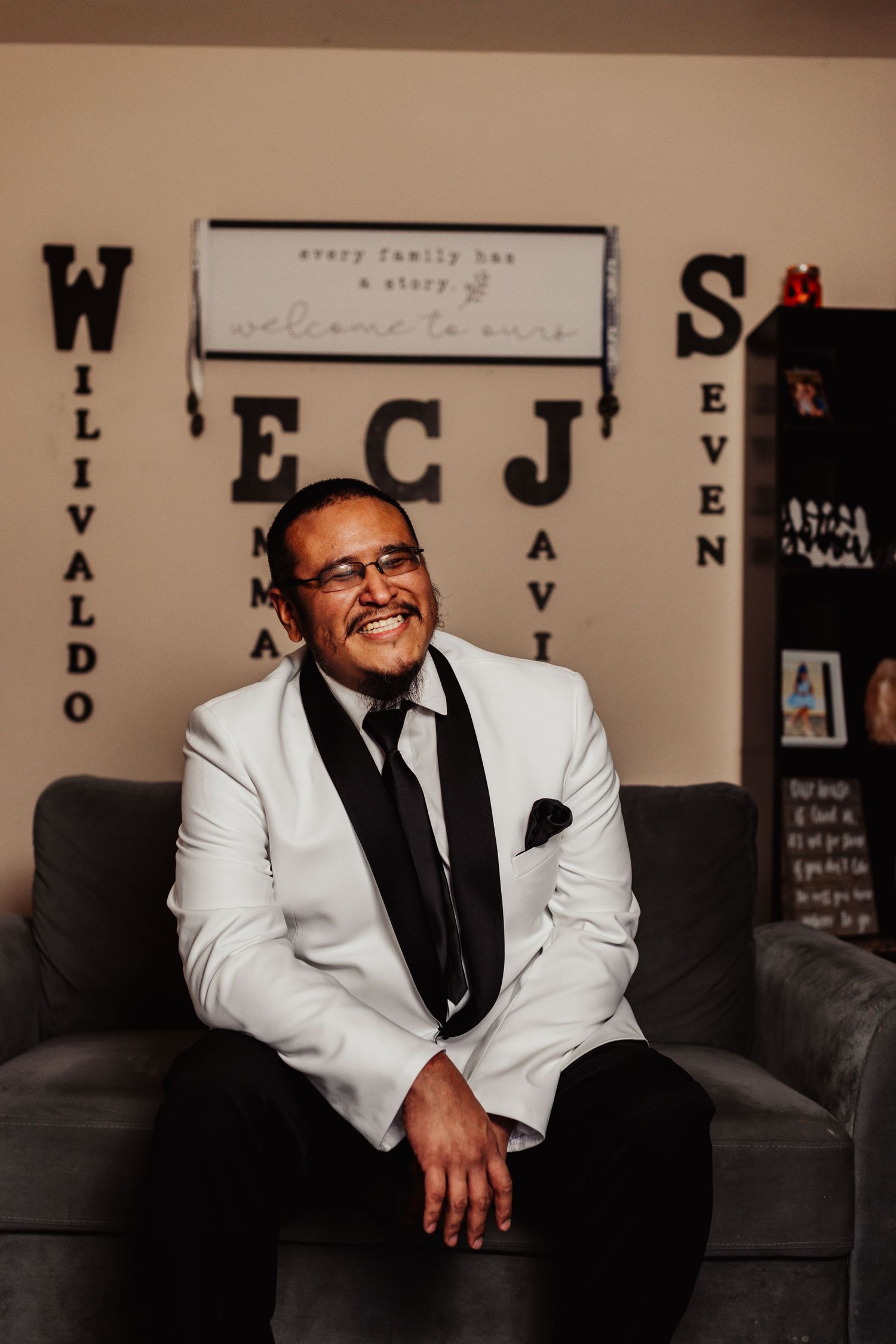Fort Worth Wedding at the Stock Yards with golden lights and a groom with white tux and groomsmen dressed in black