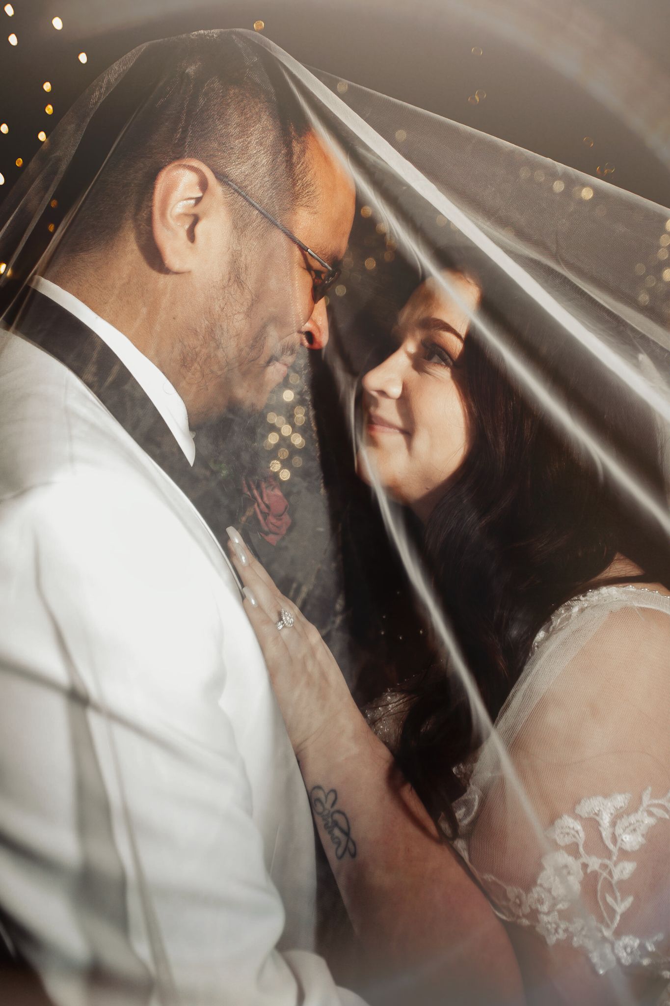 Fort Worth Wedding at the Stock Yards with golden lights and a white ivory dress and white tux