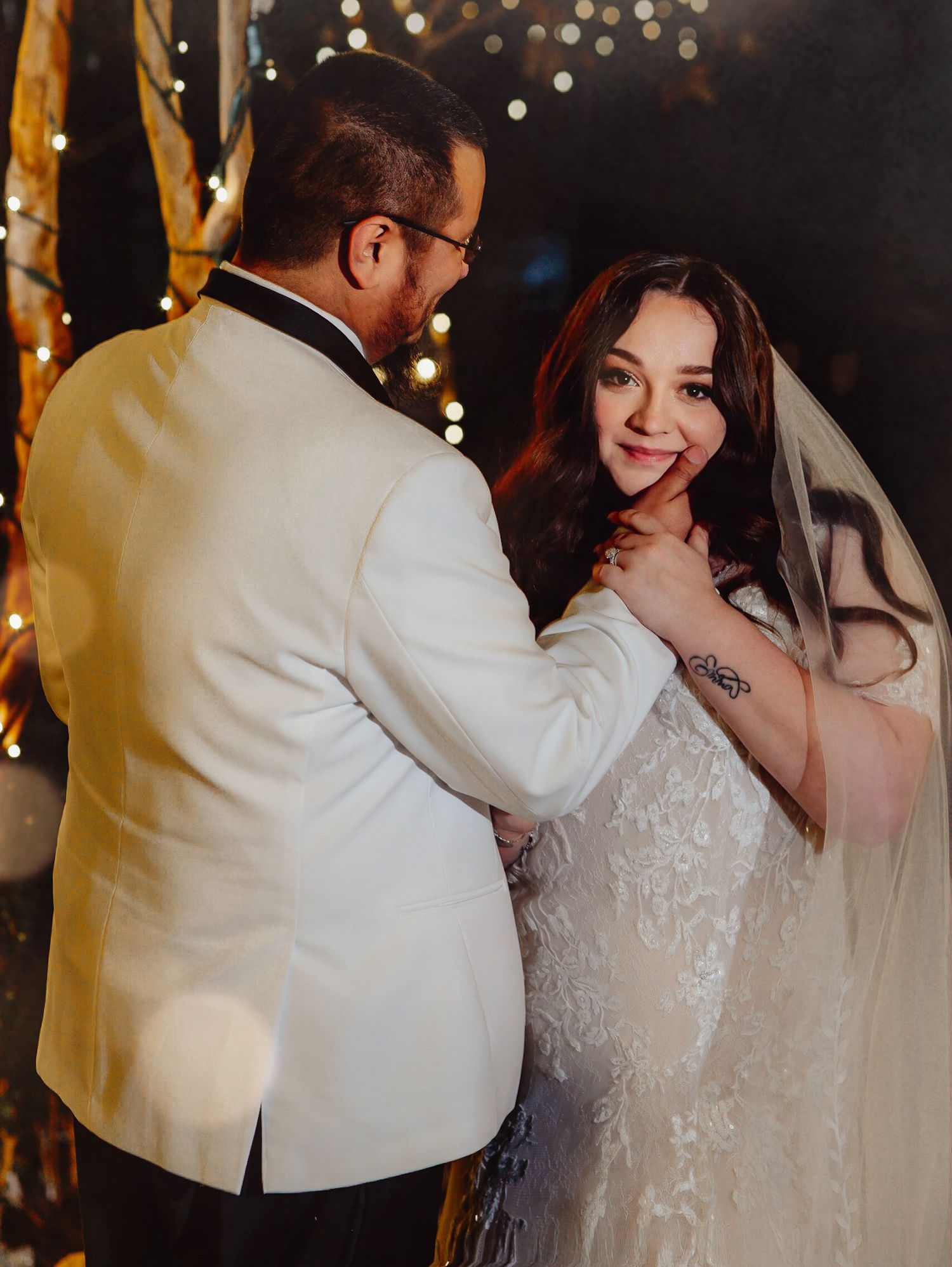 Fort Worth Wedding at the Stock Yards with golden lights and a white ivory dress and white tux