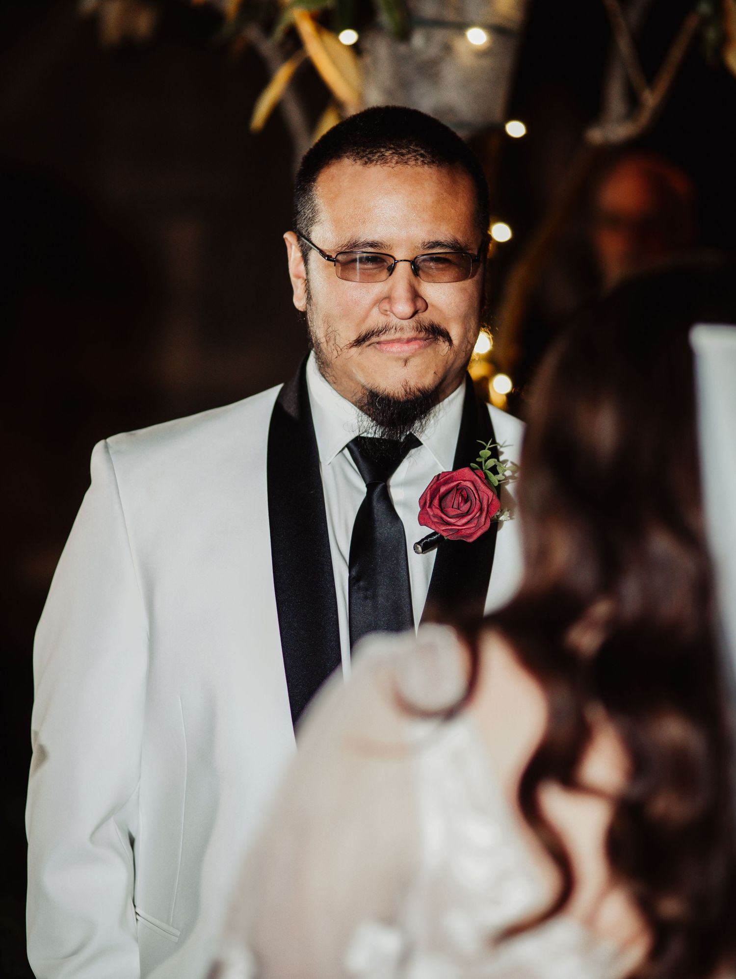 Fort Worth Wedding at the Stock Yards with golden lights and a white ivory dress and white tux