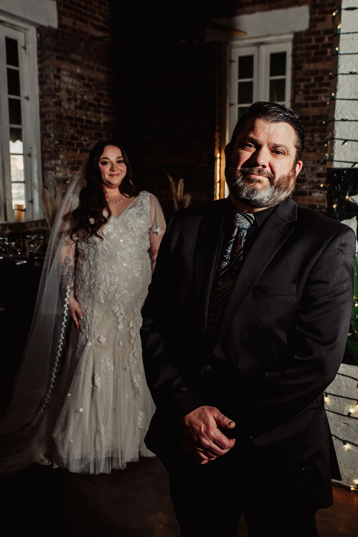 Fort Worth Wedding at the Stock Yards with golden lights and a white ivory dress and white tux