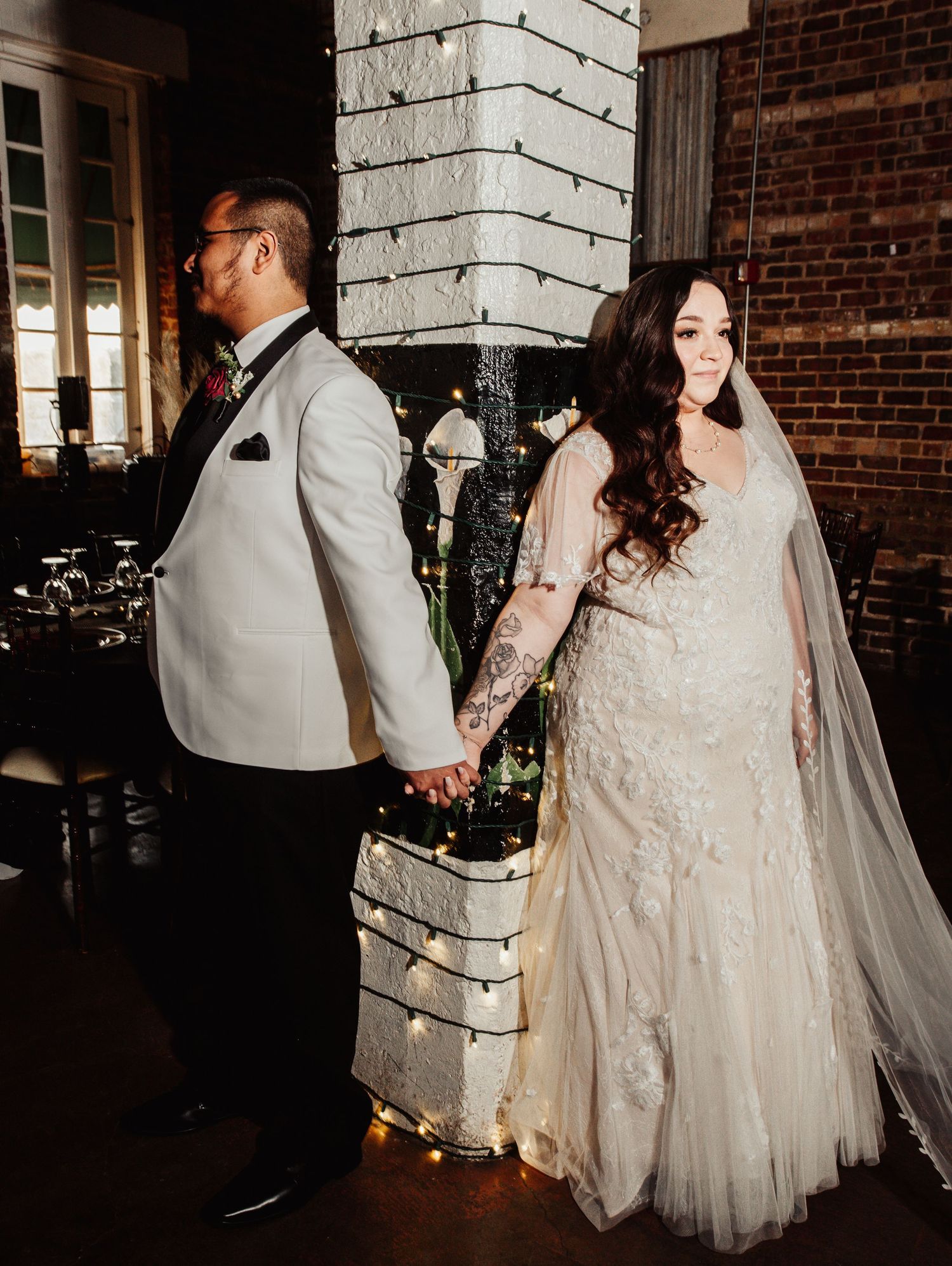 Fort Worth Wedding at the Stock Yards with golden lights and a white ivory dress and white tux