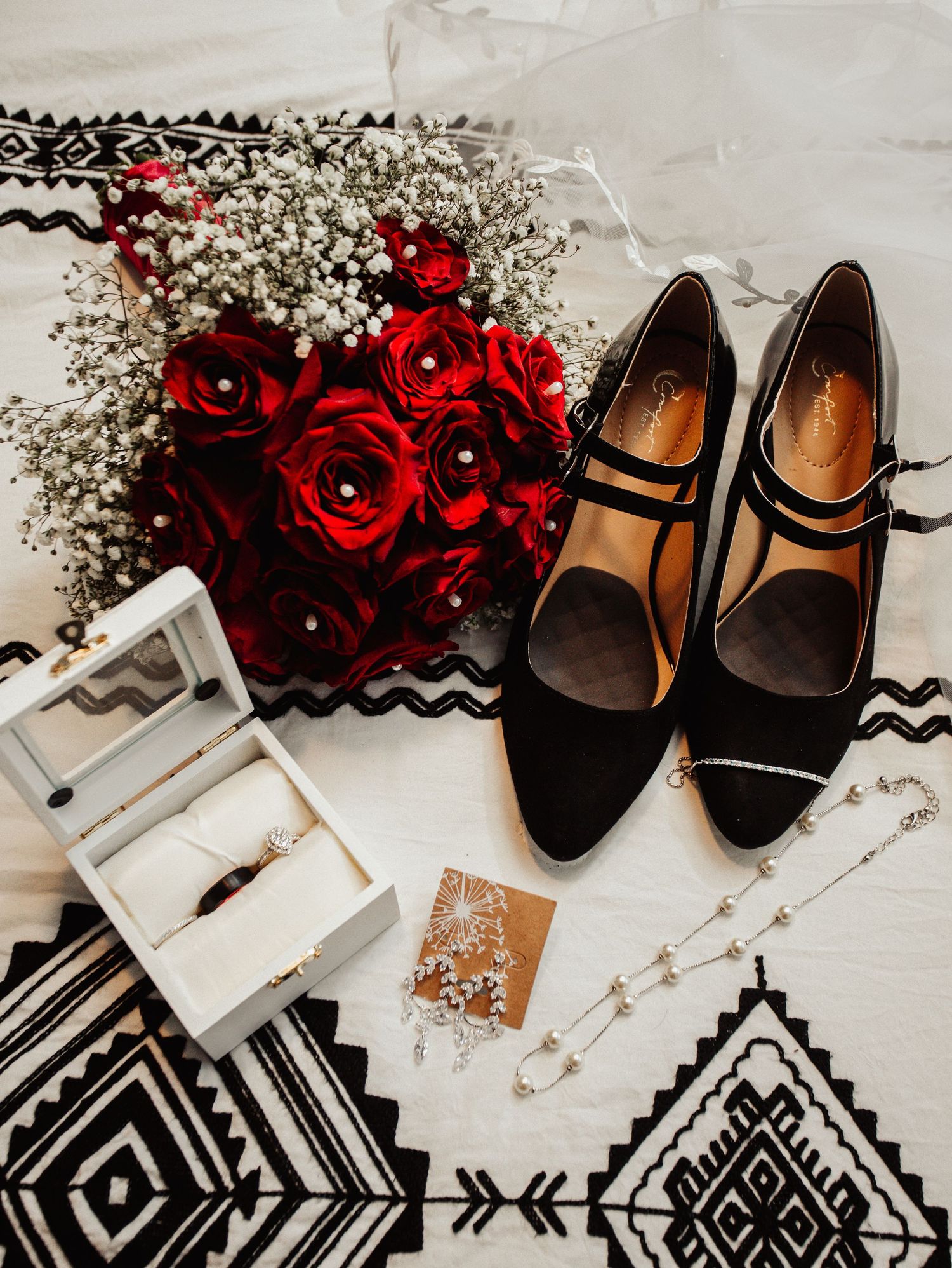Fort Worth Wedding at the Stock Yards with rose red colors and a white ivory dress heart diamond ring