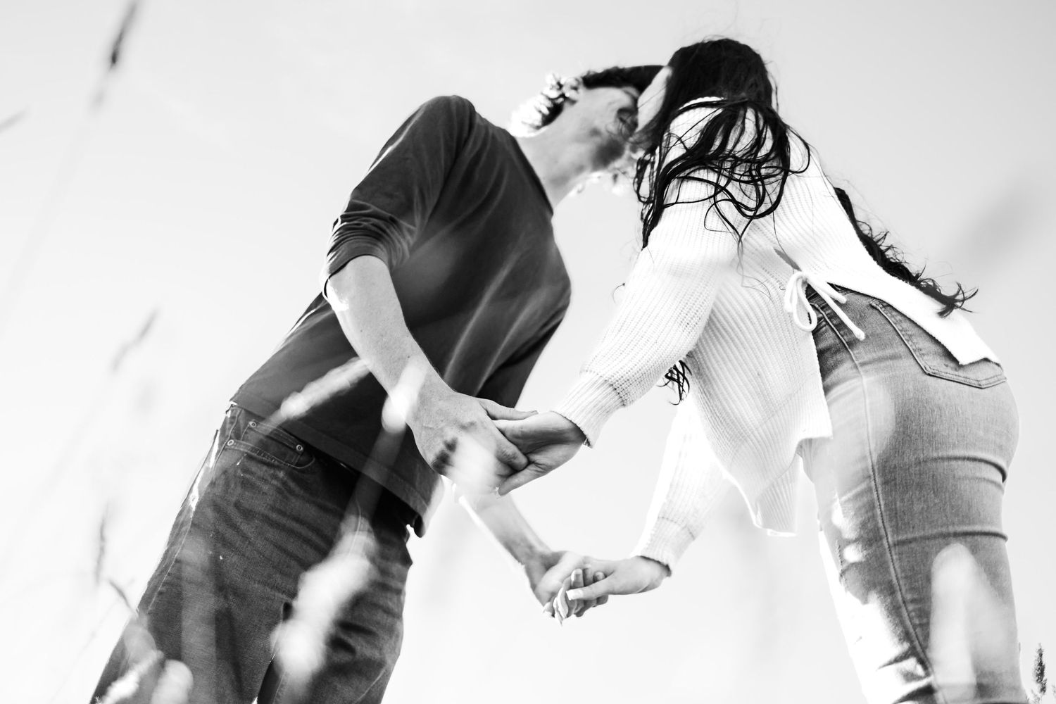 couple holding hands, black and white image
