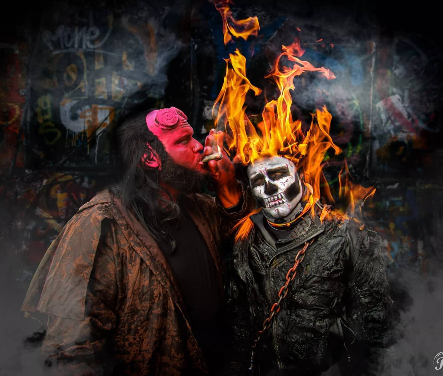 Dark horror scene with skull mask figure and flames against graffiti background.