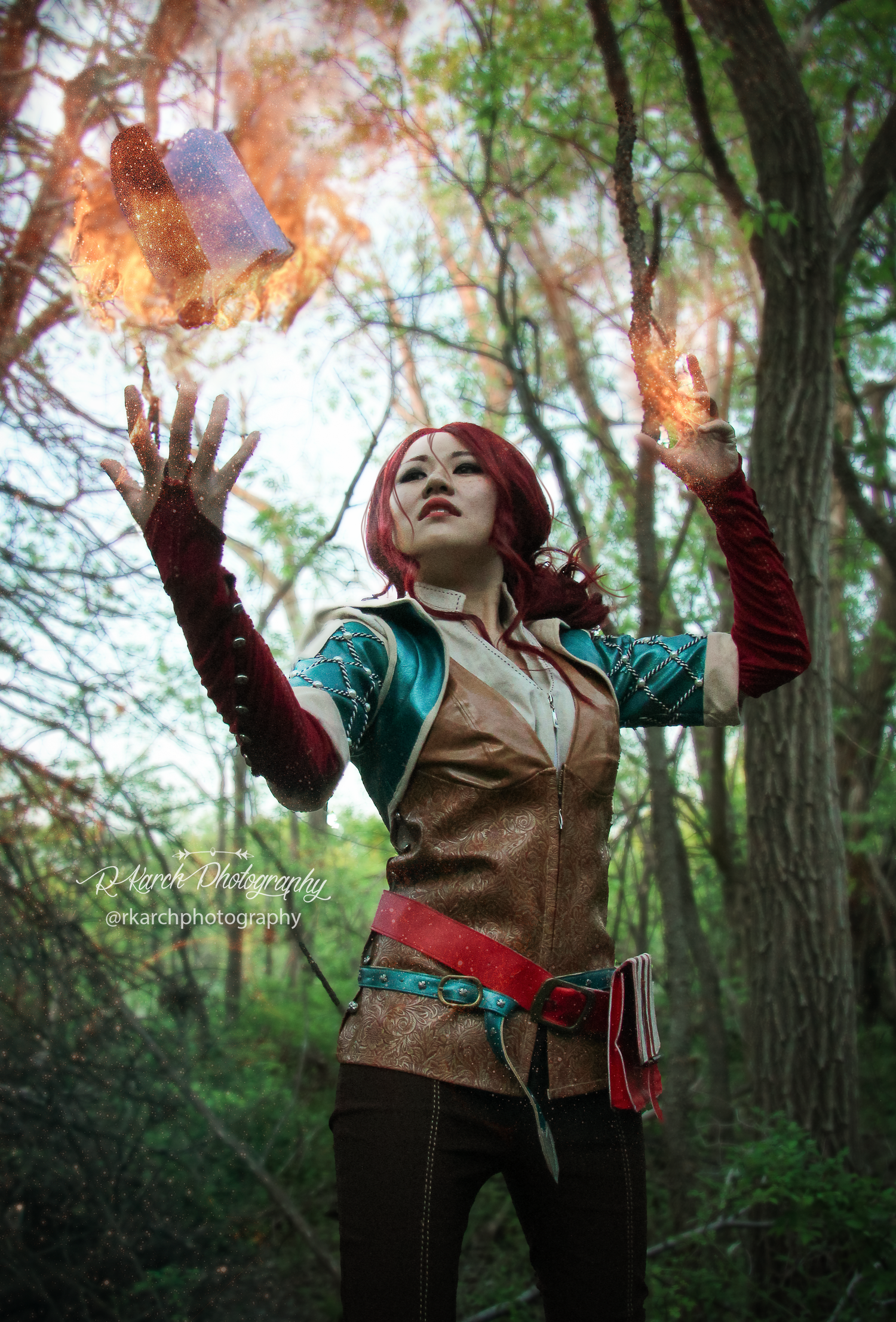 Fantasy-themed portrait with magical fire effects in forest setting.