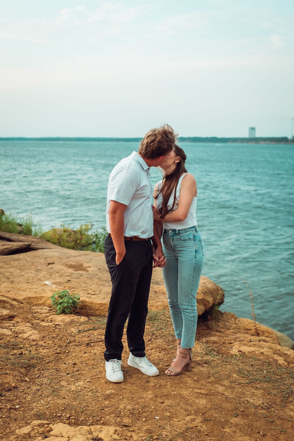 A romantic Engagement photo taken on the water