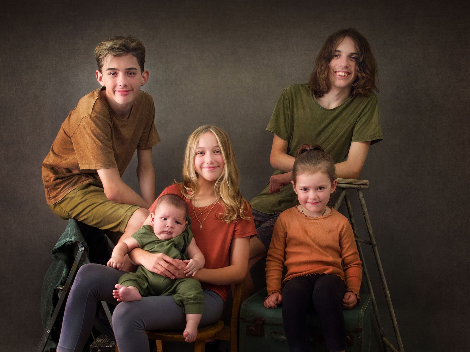 Casual Family Portrait of 5 siblings wearing warm earthy tones