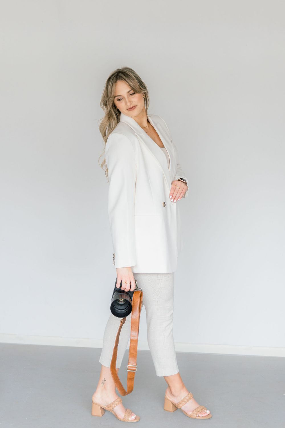 Leah Anne Kopp brand photo walking with camera
