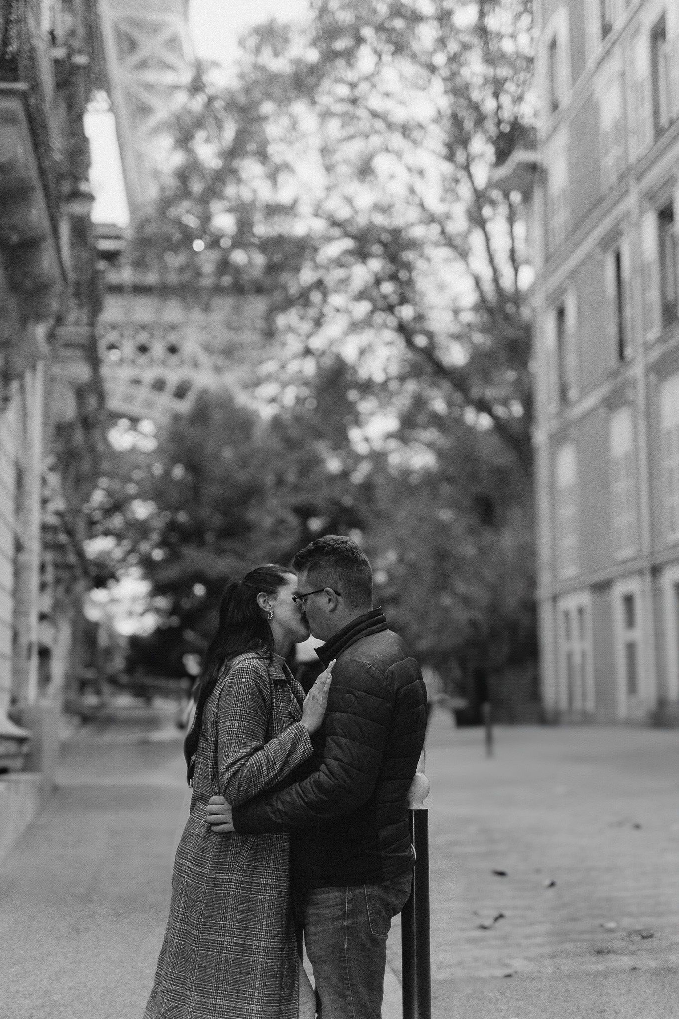 Couple kissing during their Paris proposal photoshoot