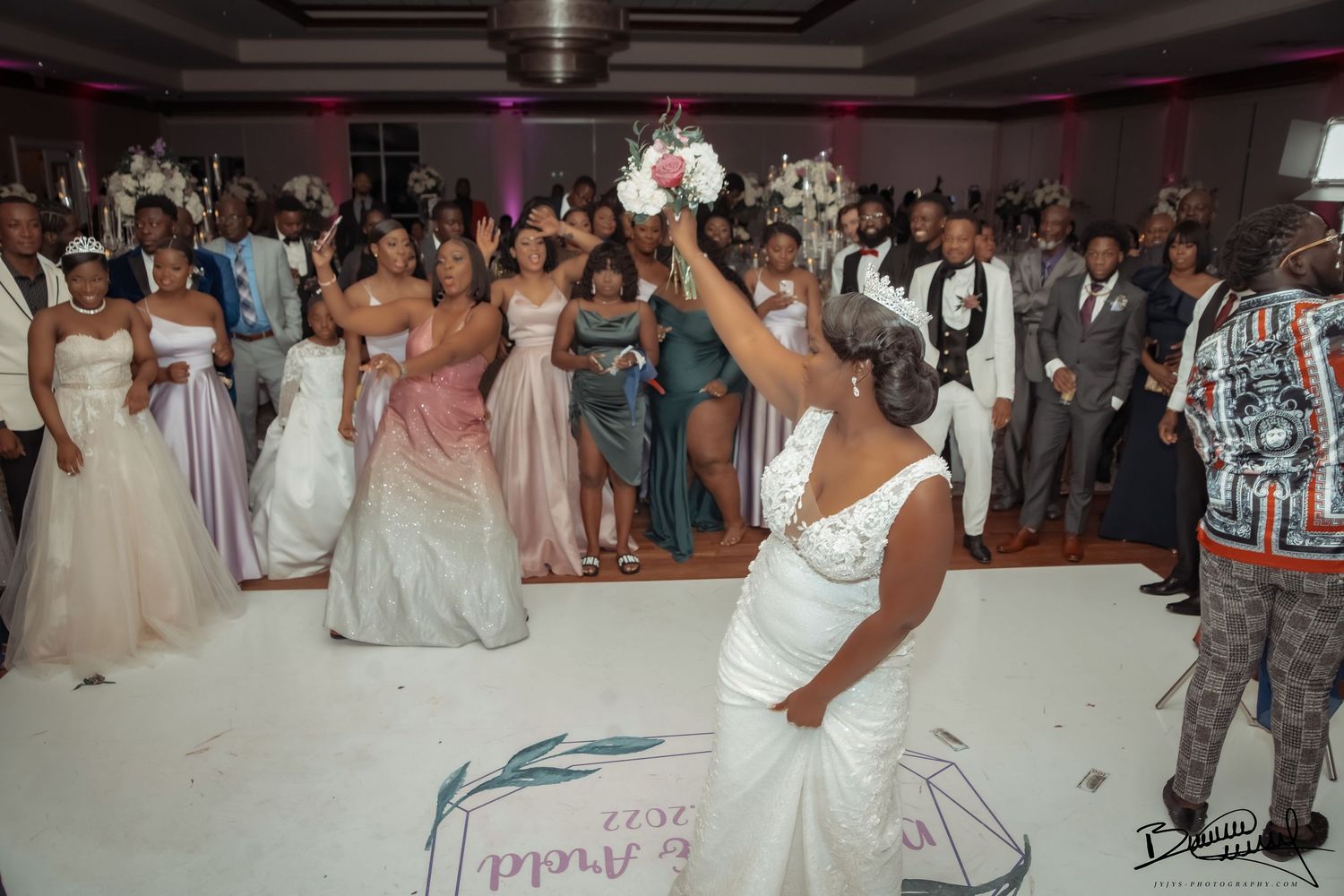 bride's joyful bouquet toss moment, beautifully captured by Jyjys-Photography, a wedding photography in west palm beach