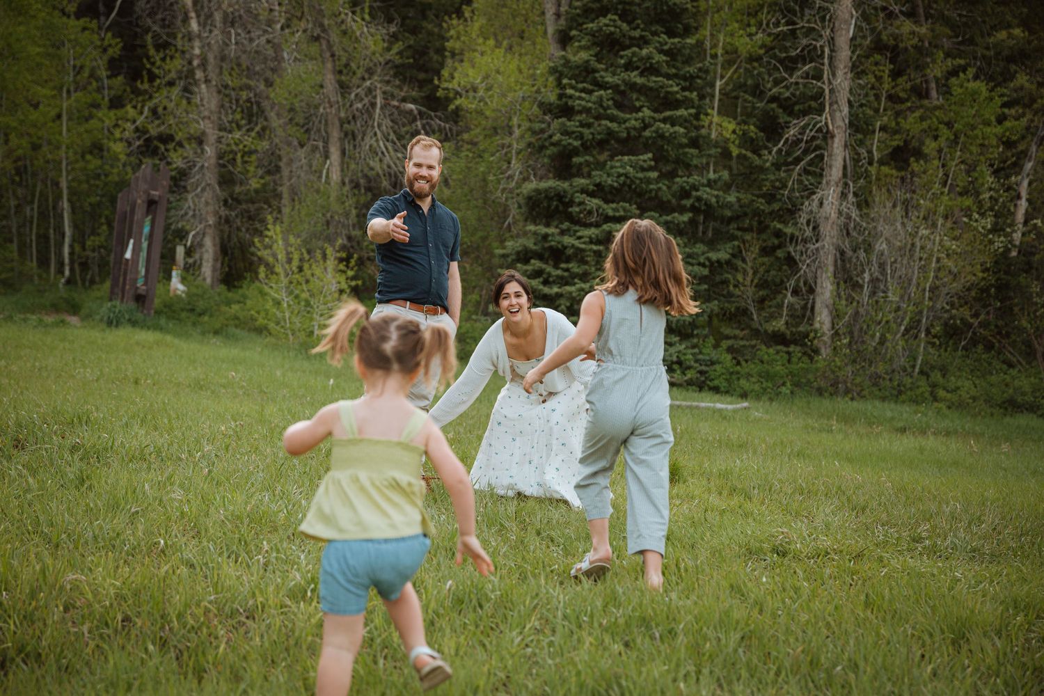 family running together in the summer in provo canyon
