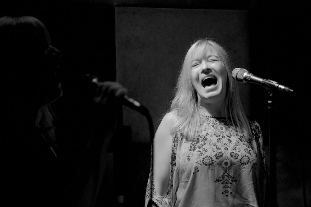 Back up singer performing at a bar in NYC