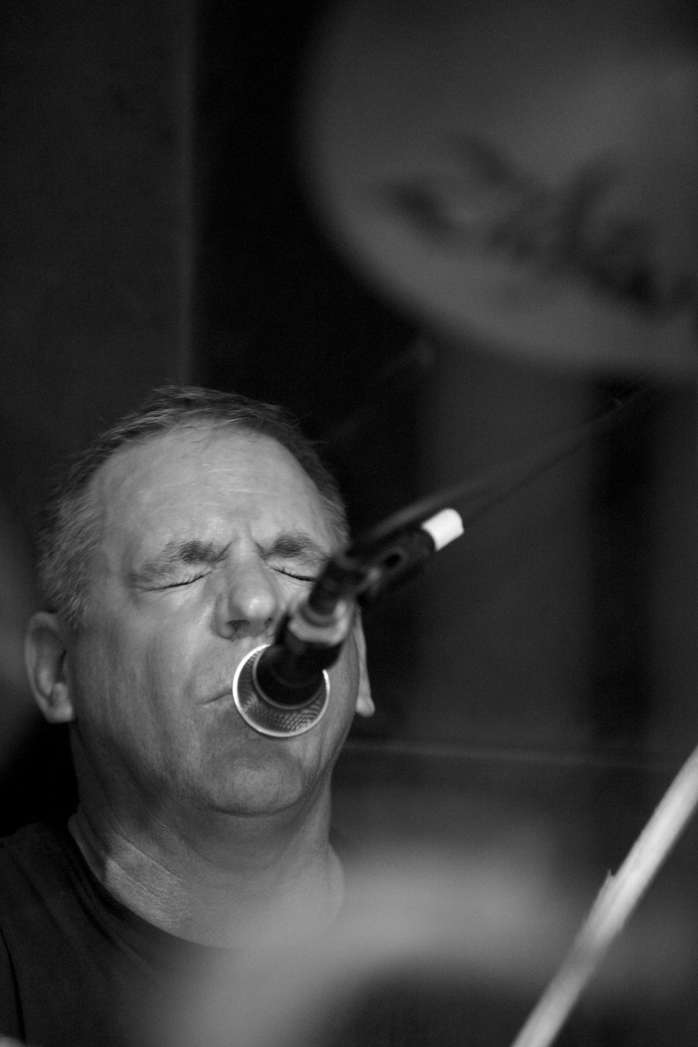 The drummer singing during a set