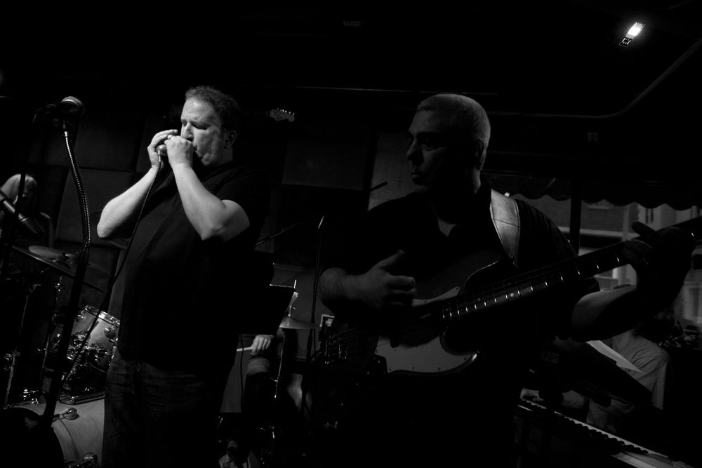 Belting out a song on a harmonica