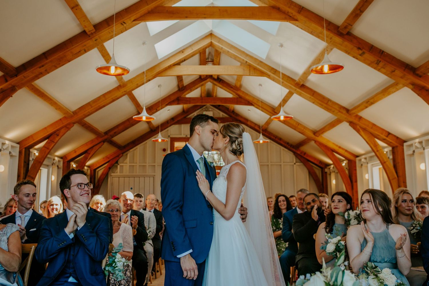 Bride and Goom first kiss at their wedding at Hyde House, The Cotswold