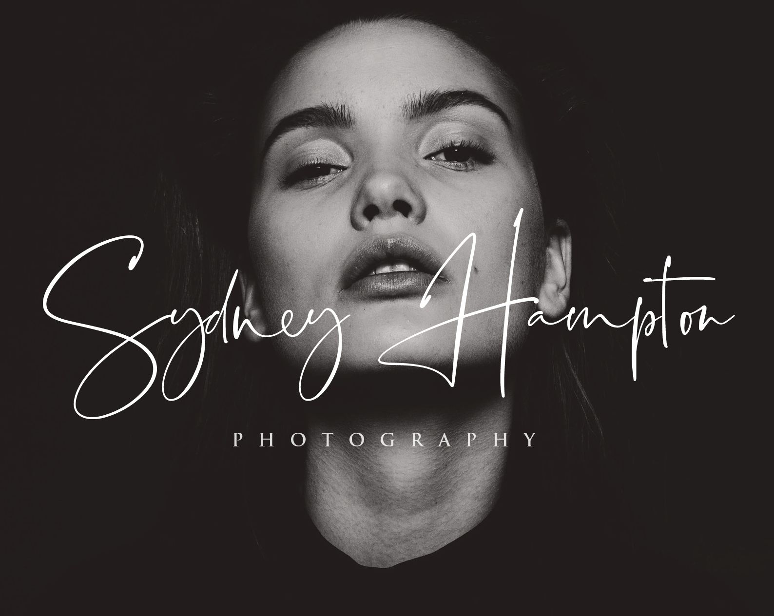 Black and white photography logo design with elegant script typography.