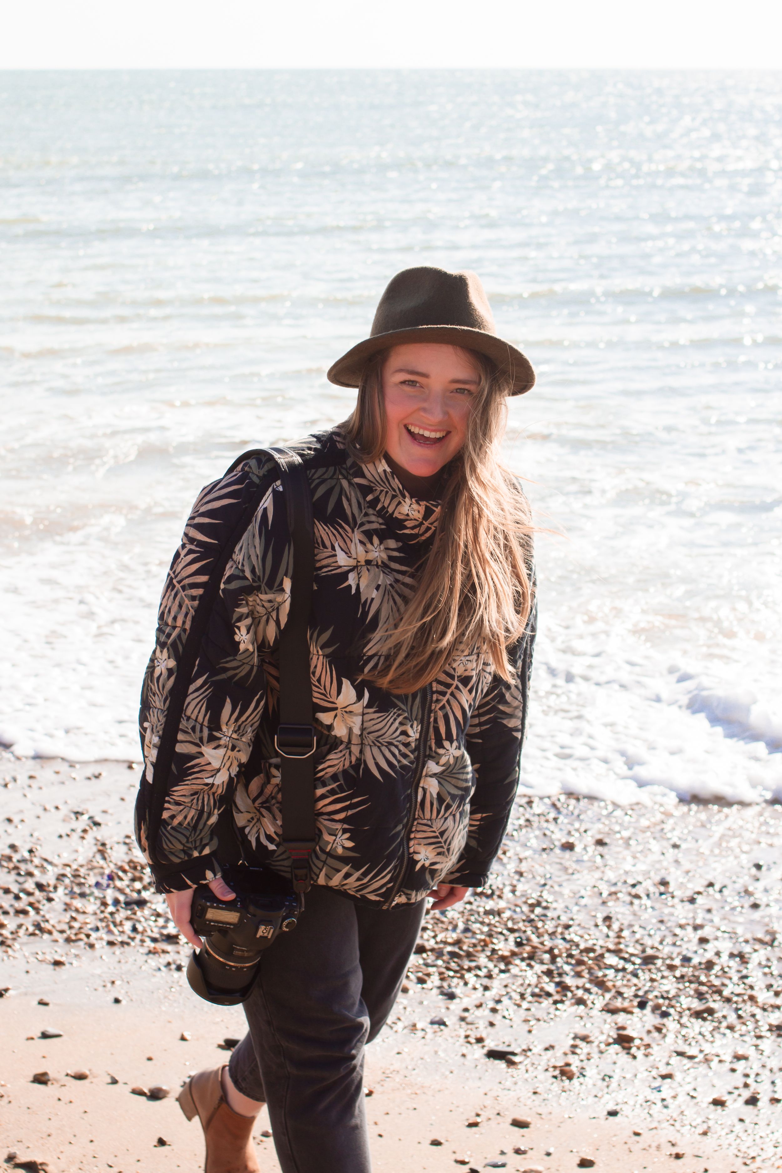 sarah marie smiling on beach