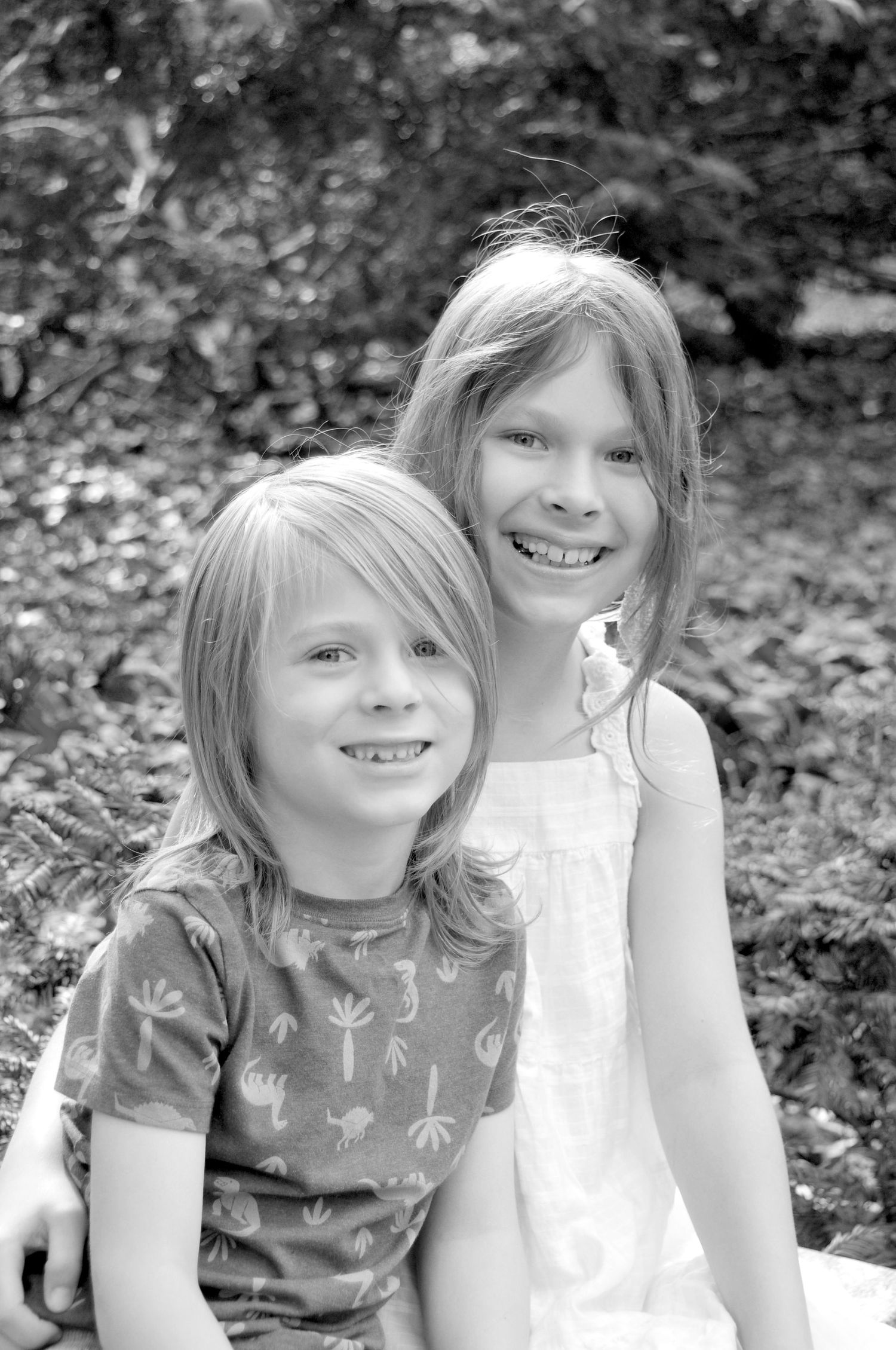 Black and white picture of two children outside