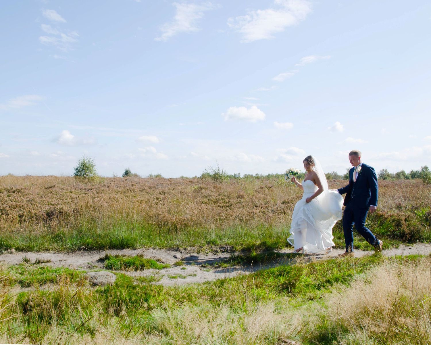 Rob and Victoria' walking up for their photographs taking on Norland Moor