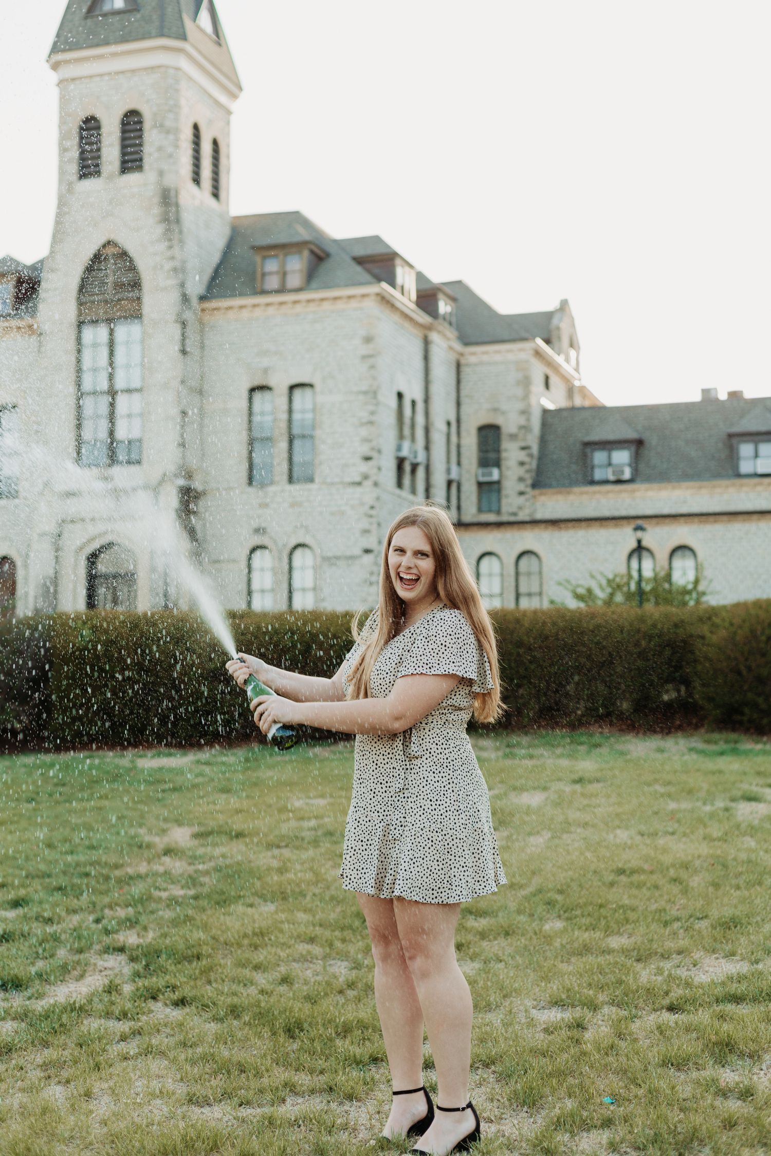 Senior photos in Manhattan, Kansas by portrait photographer – golden hour outdoor session with natural, candid senior portraits.