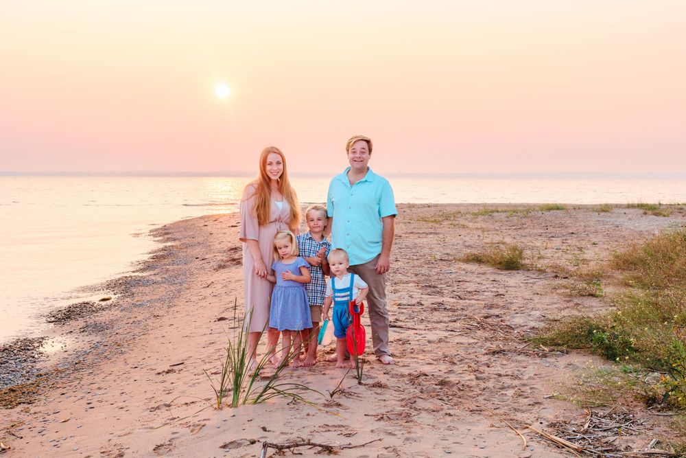 family portraits on the beach at sunset