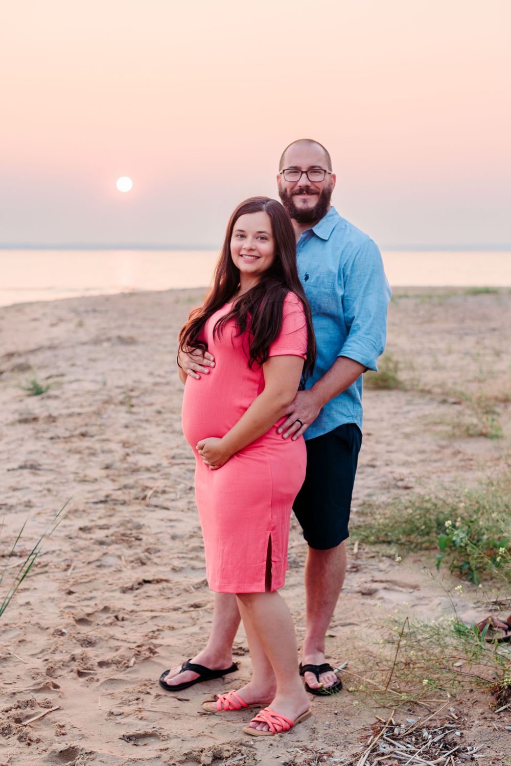 maternity portraits on the beach at sunset