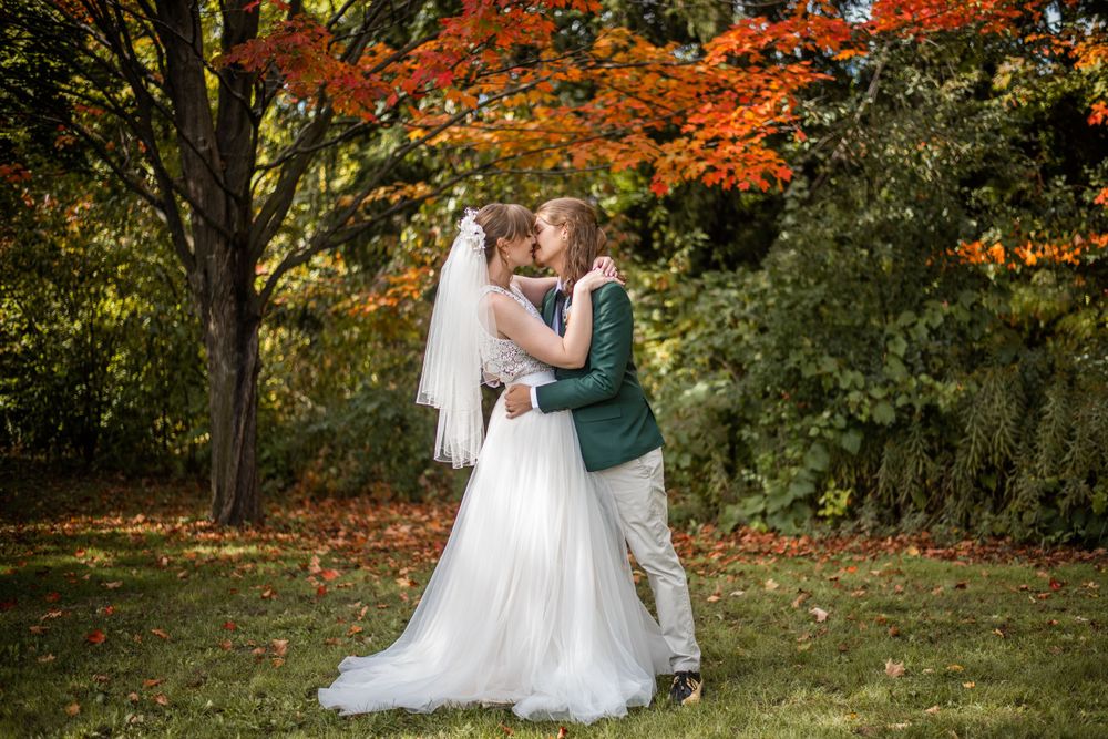 bride and groom kissing outdoor fall autumn wedding photo in acton ontario