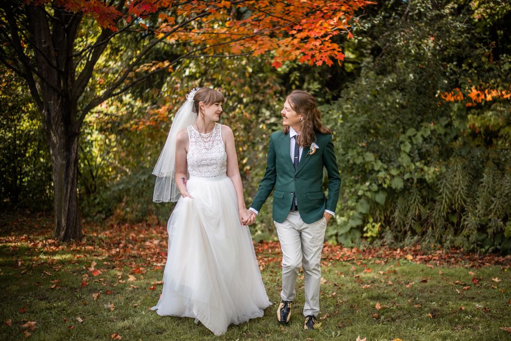 bride and groom walking outdoor fall autumn wedding photo in acton ontario