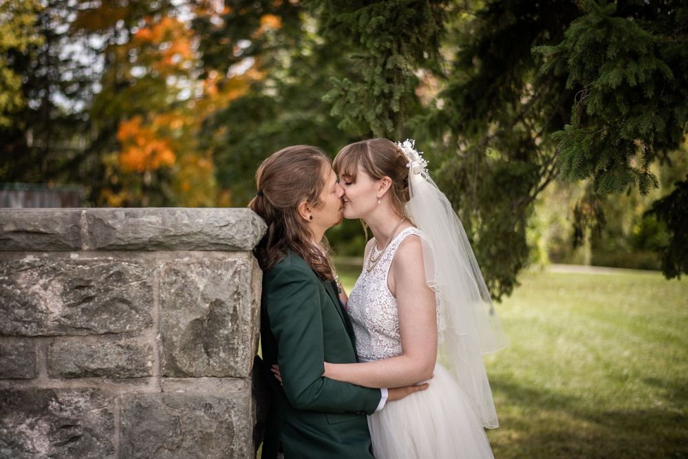 bride and groom kissing outdoor fall autumn wedding photo in acton ontario