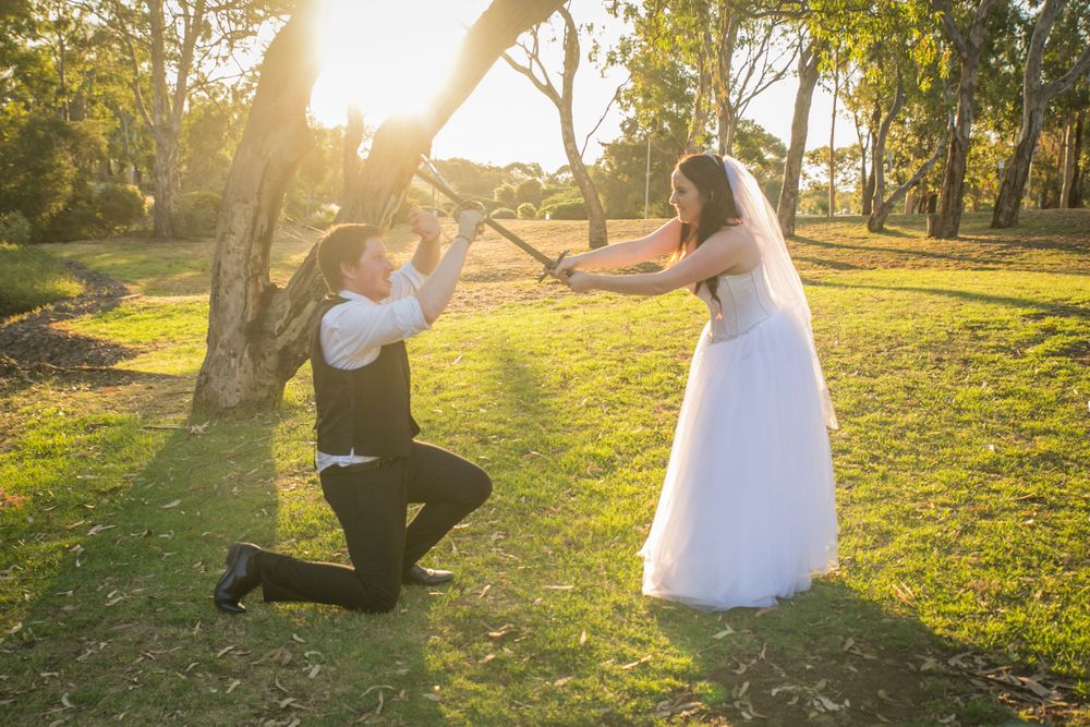bride and groom sword fighting geelong wedding photographer
