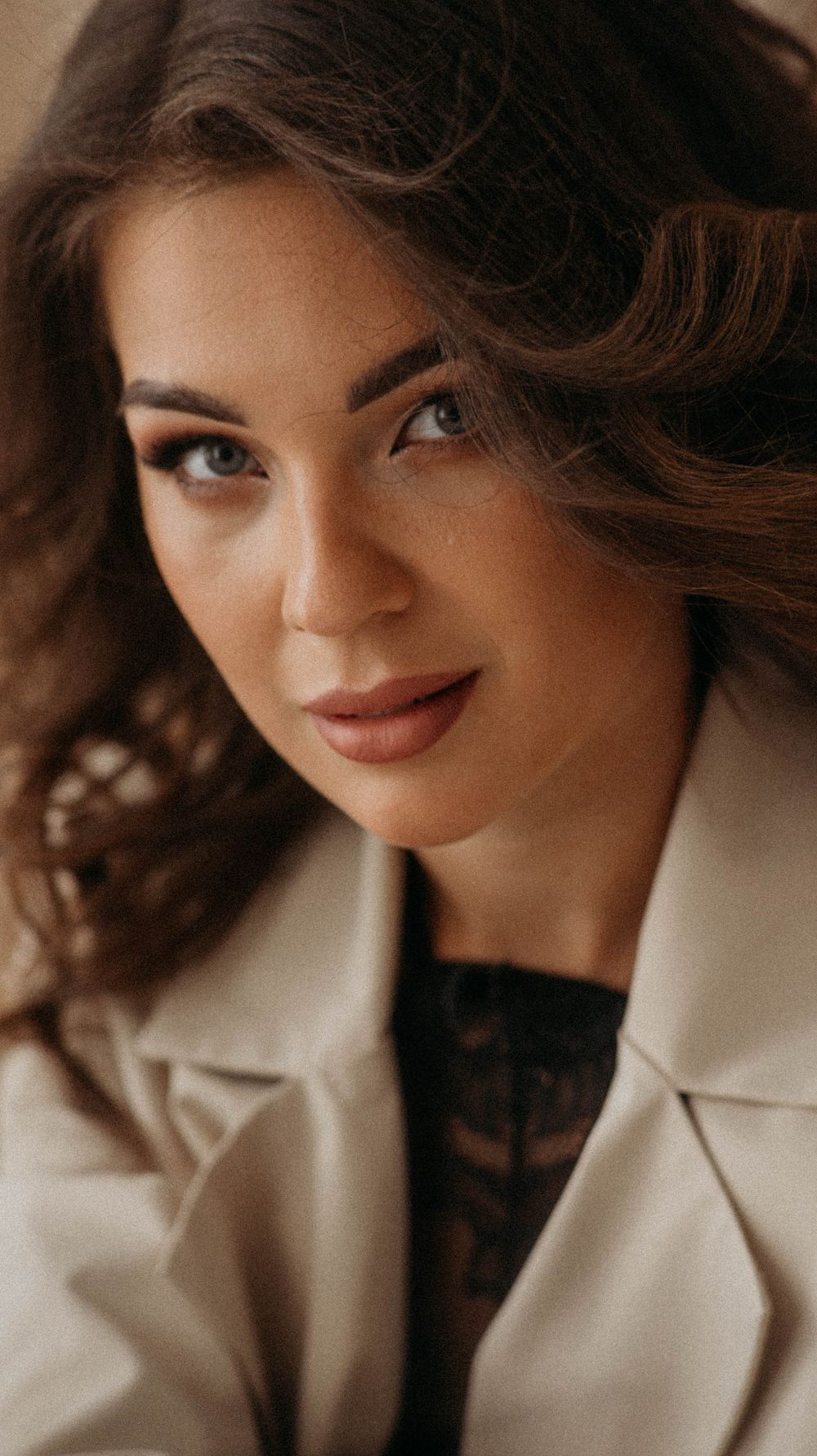 Close-up portrait series with warm tones and soft lighting against white background.