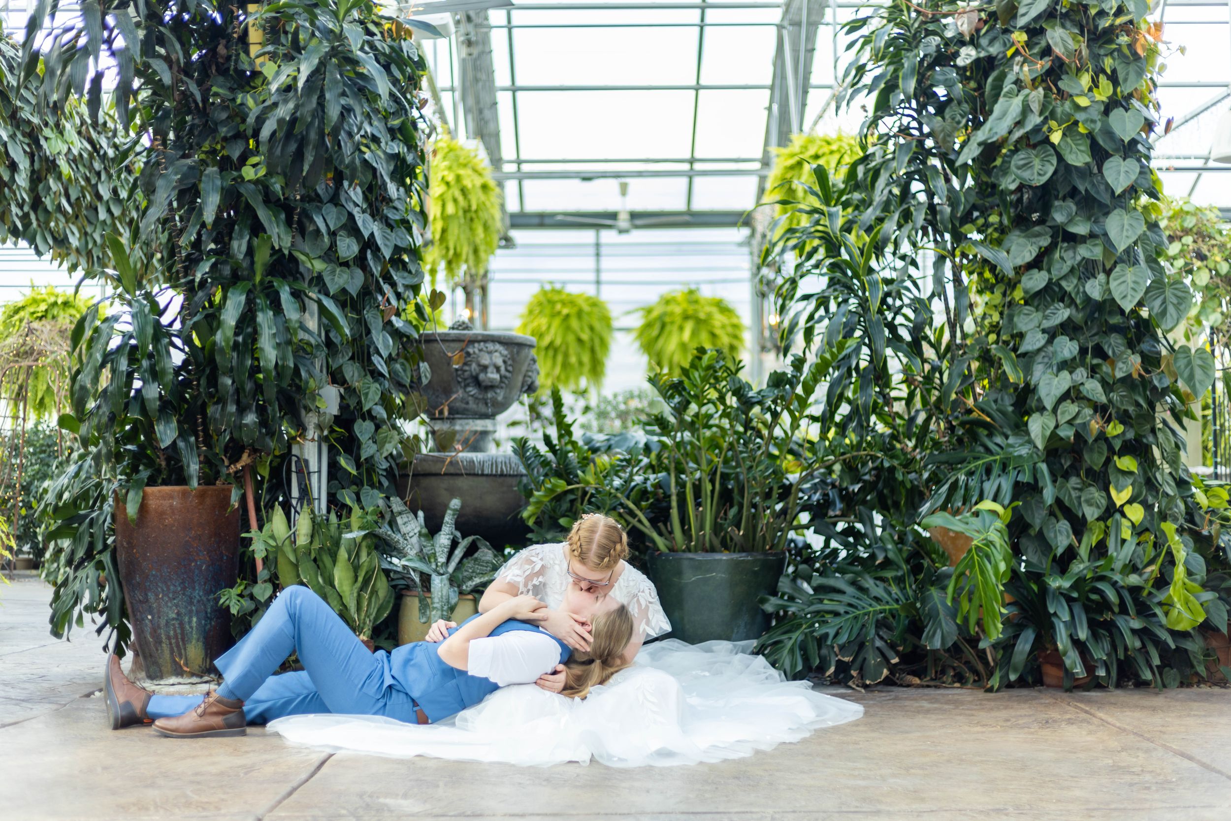A couple kissing on the floor at Le Jardin in Utah