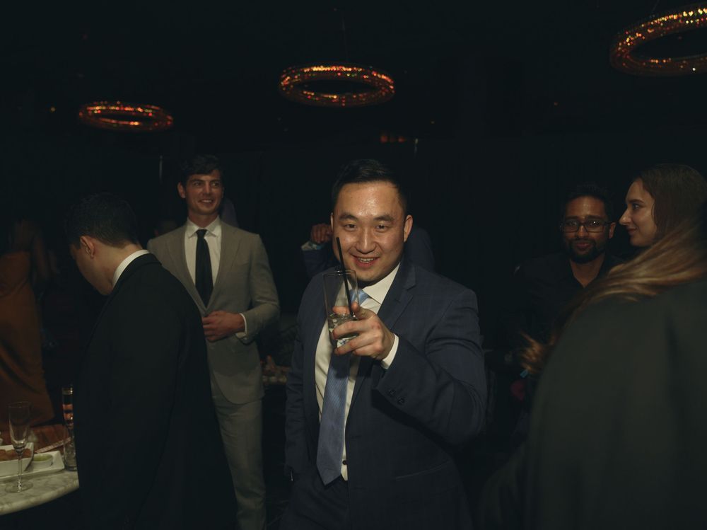having a drink at a corporate event photographed by Leonard Okpor