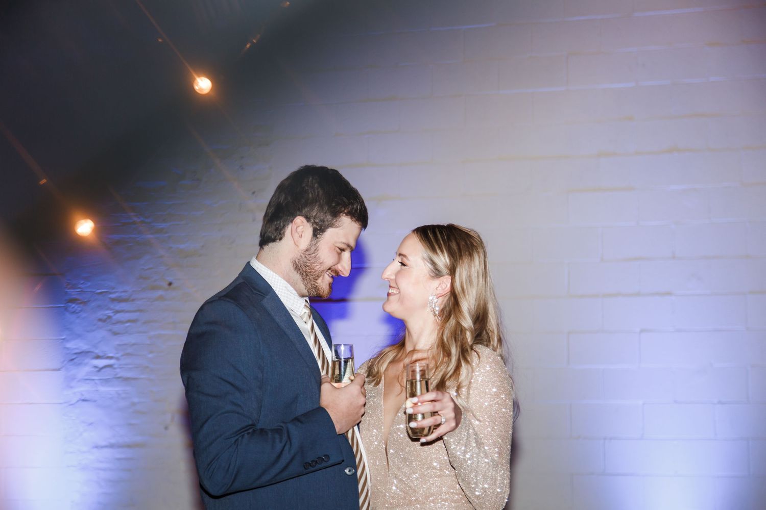 Intimate moment captured with warm lighting and party atmosphere on New Years Eve, Lancaster, PA.