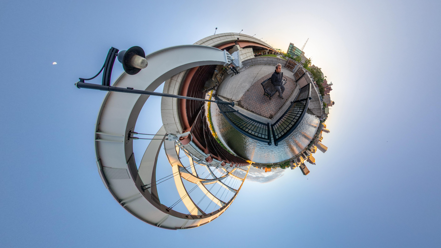 Spiral architectural view against bright blue sky creating a unique circular perspective.