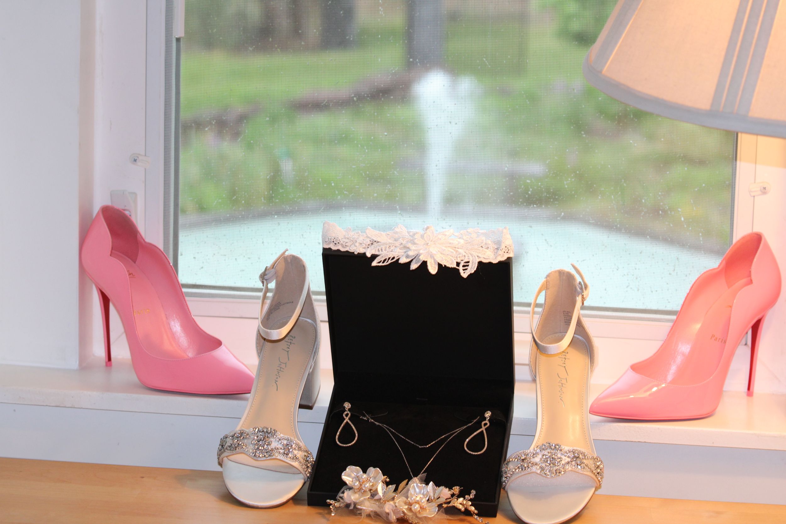 Bridal accessories display featuring pink and white heels with matching jewelry box.