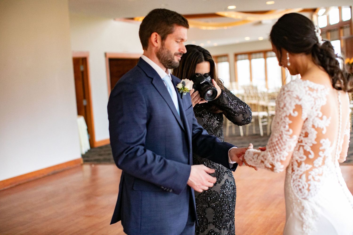 Minnesota wedding photographer Laura Leigh Images taking picture of bride and groom