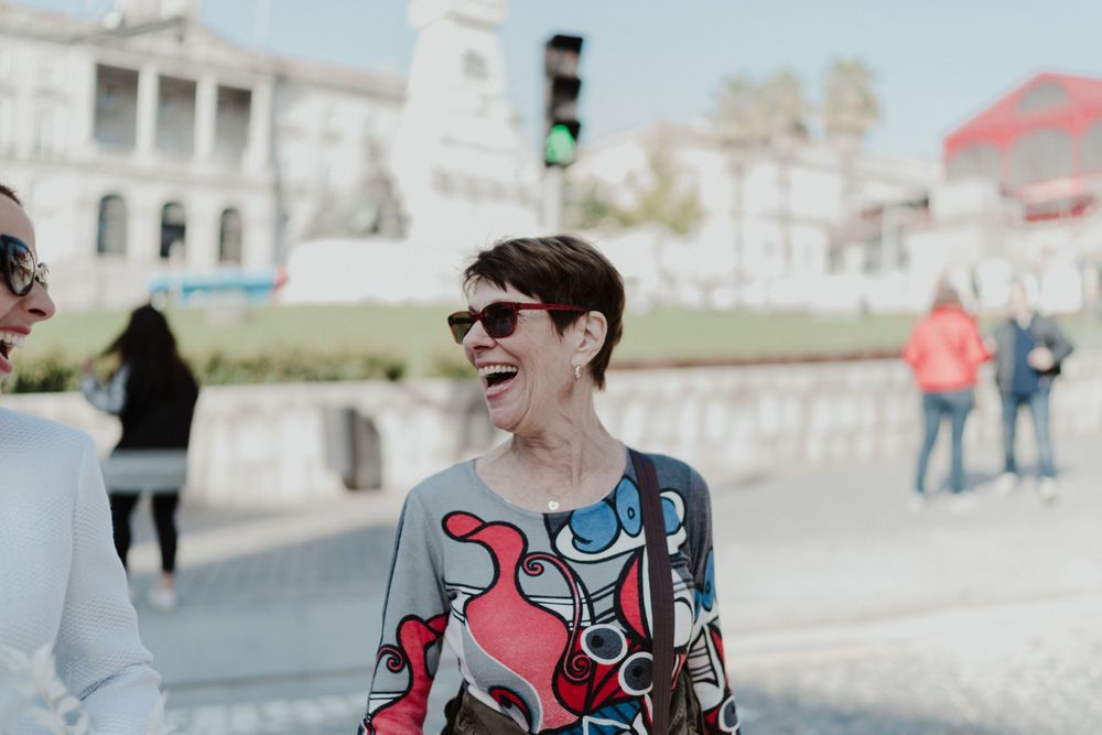 Wedding guest smiling on the streets of Porto