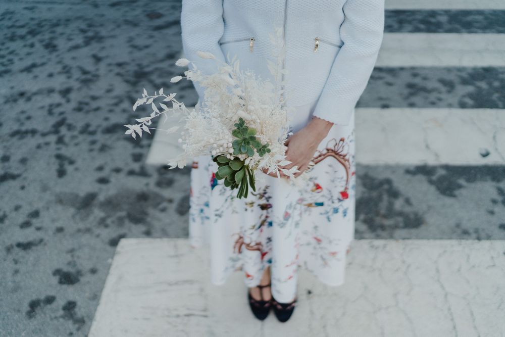 Bride holding flowers during an intimate wedding in Porto