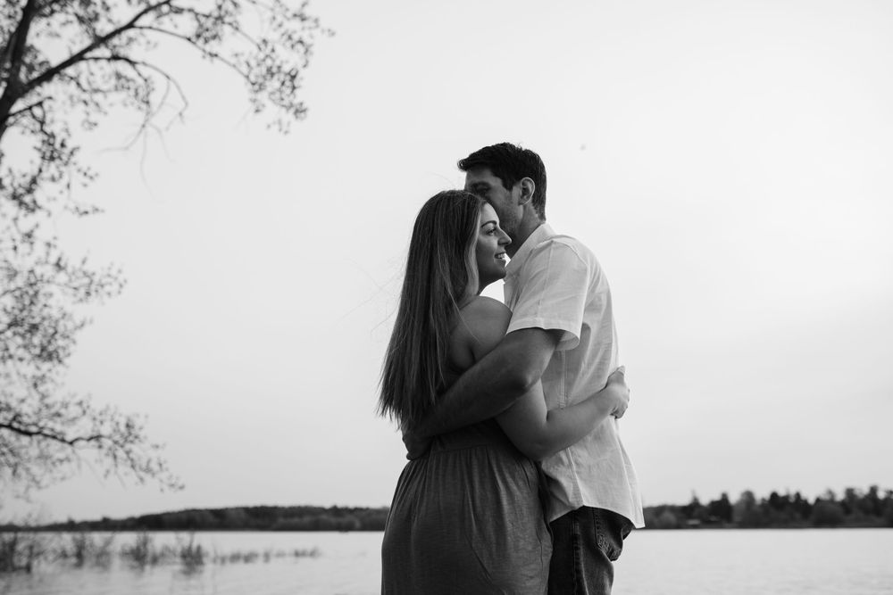 A series of intimate black and white photos showing a couple by the water.
