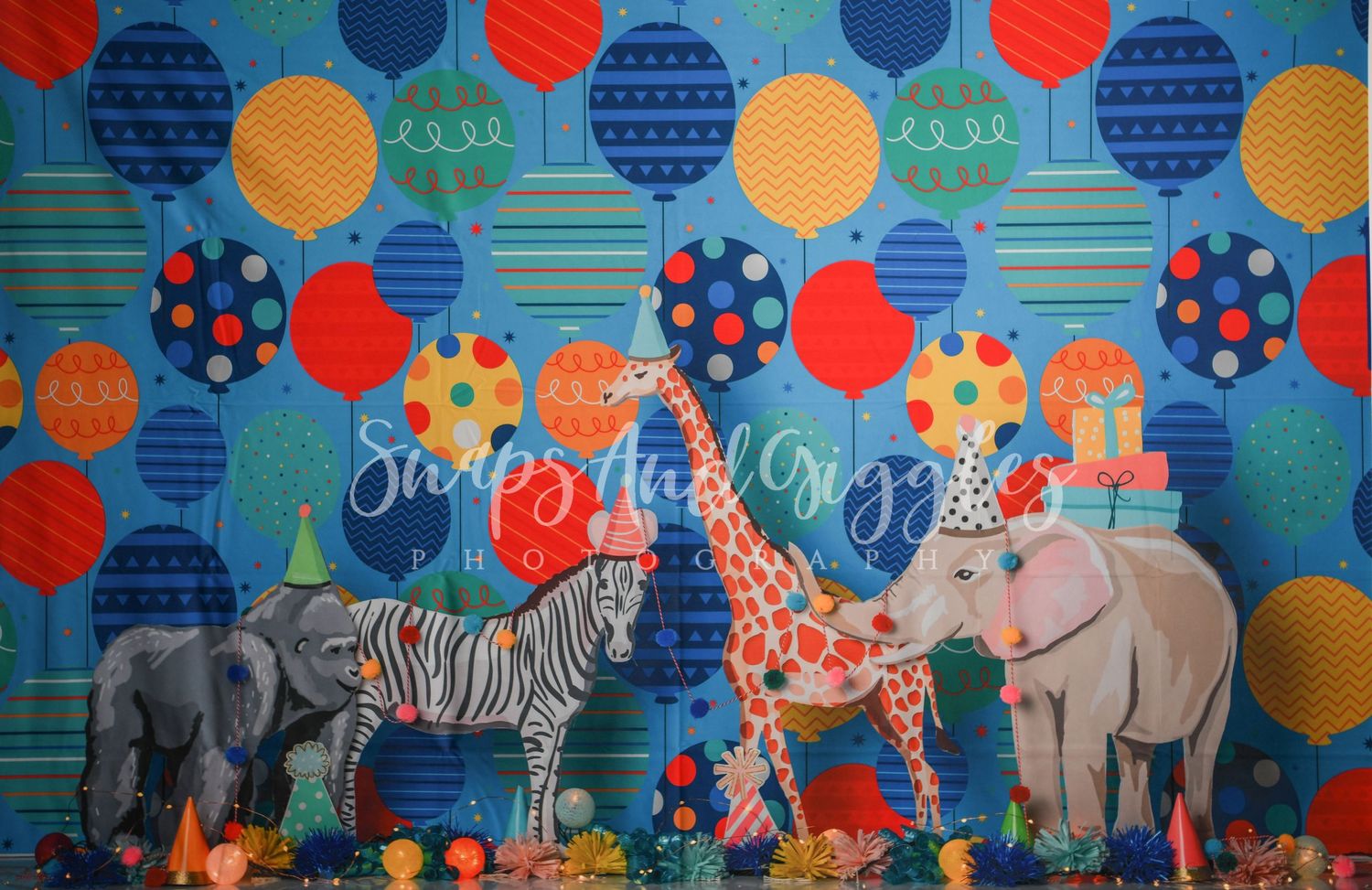 Safari-themed backdrop with colorful animals, balloons, and jungle elements.