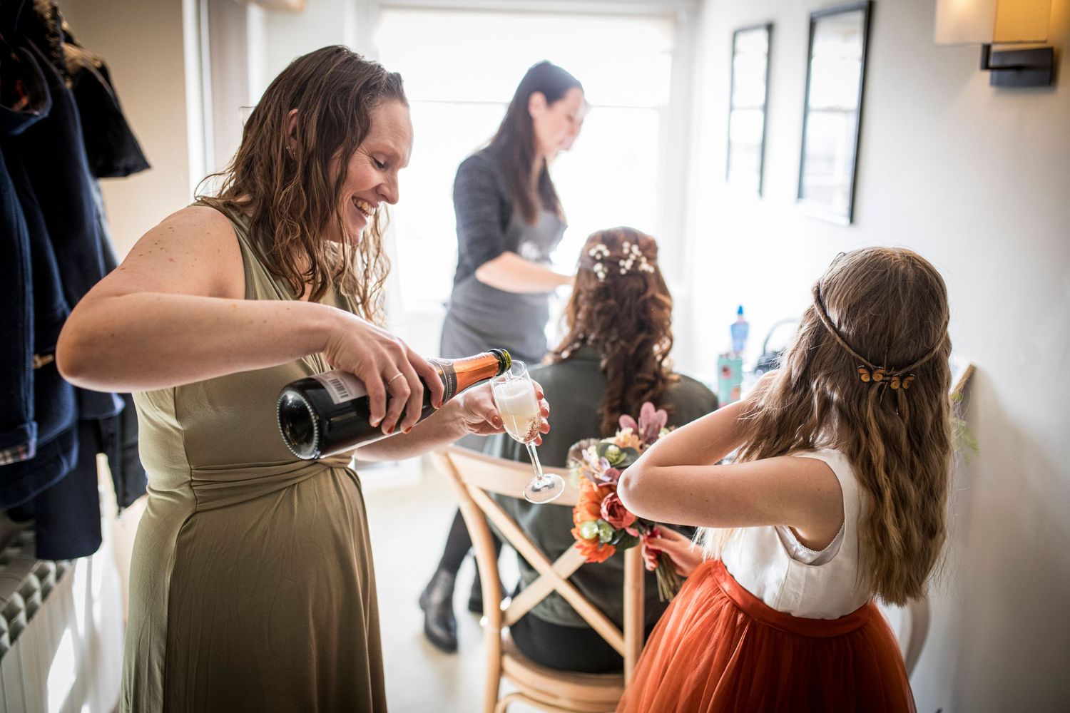 A wedding preparation scene with styling hair in a bridal suite.