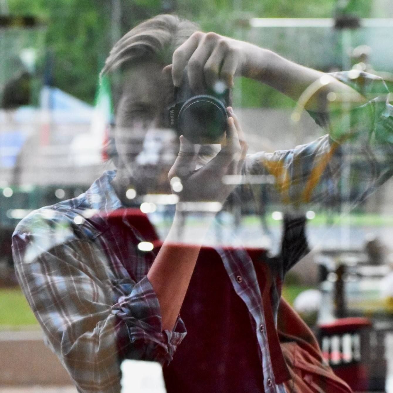 Photographer taking picture of a reflection