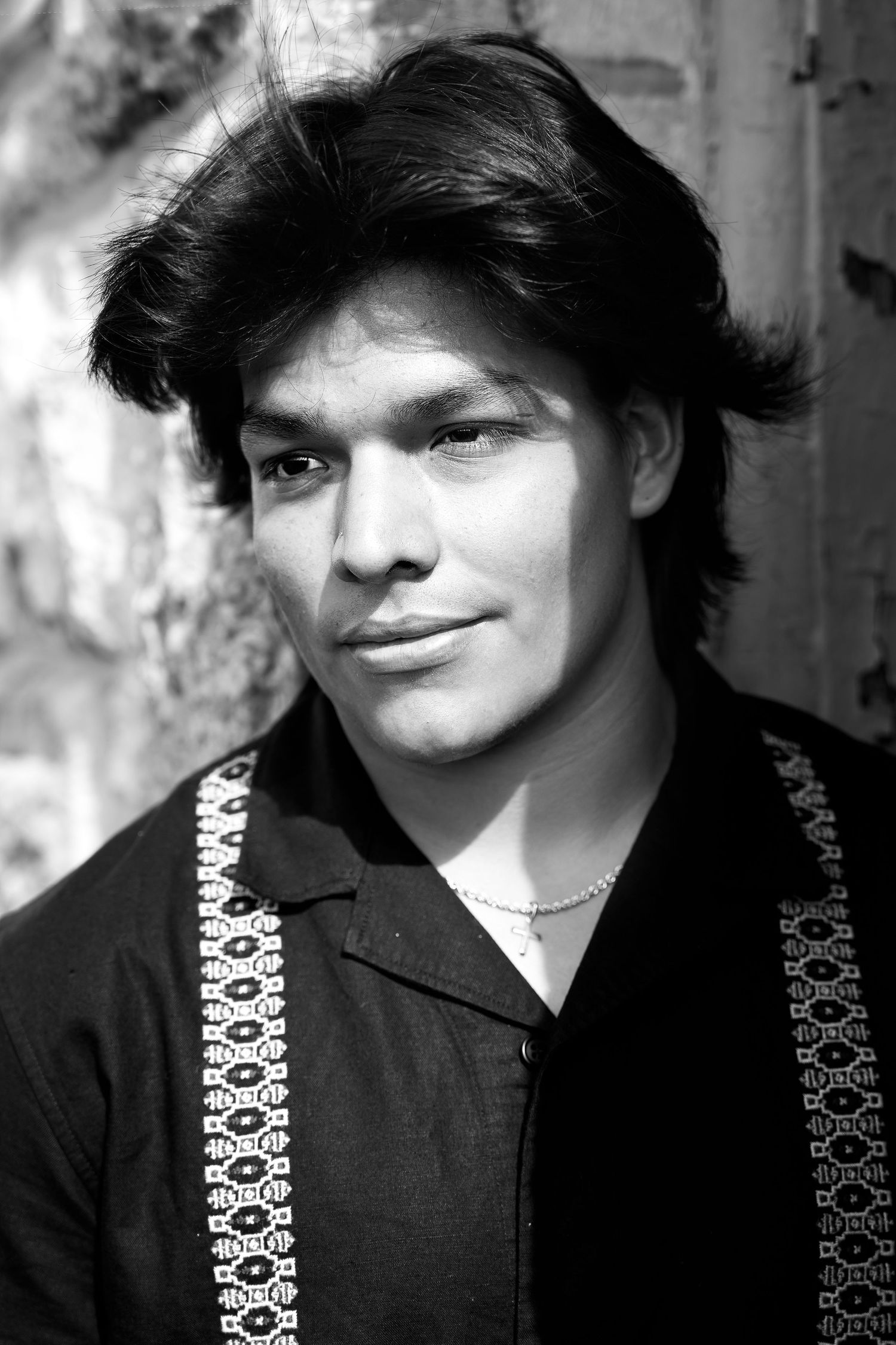 black and white portrait of high school boy wearing black button down shirt in San Antonio Texas