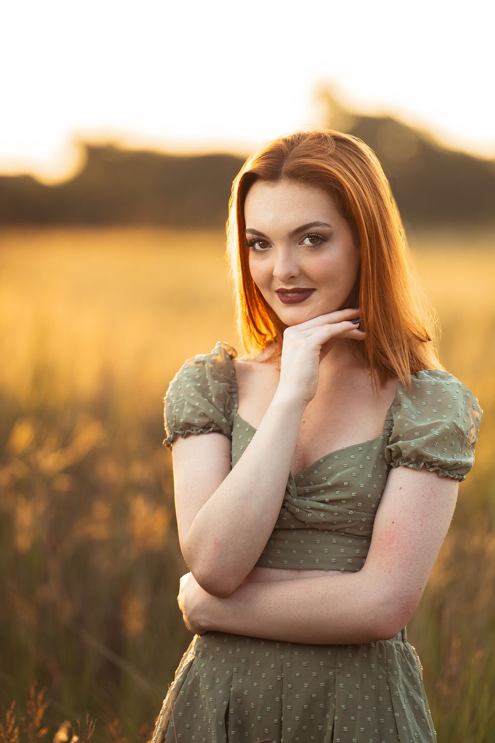high school senior girl standing in golden field at Cibolo Nature Center