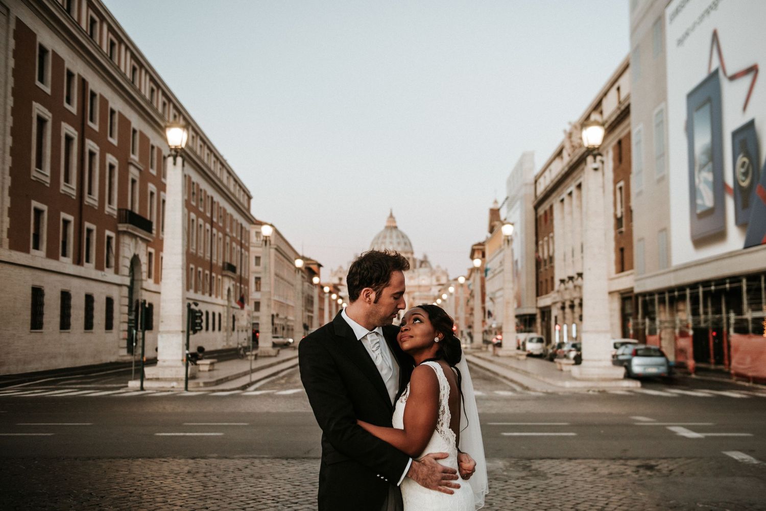Wedding photography session on historic cobblestone city street.