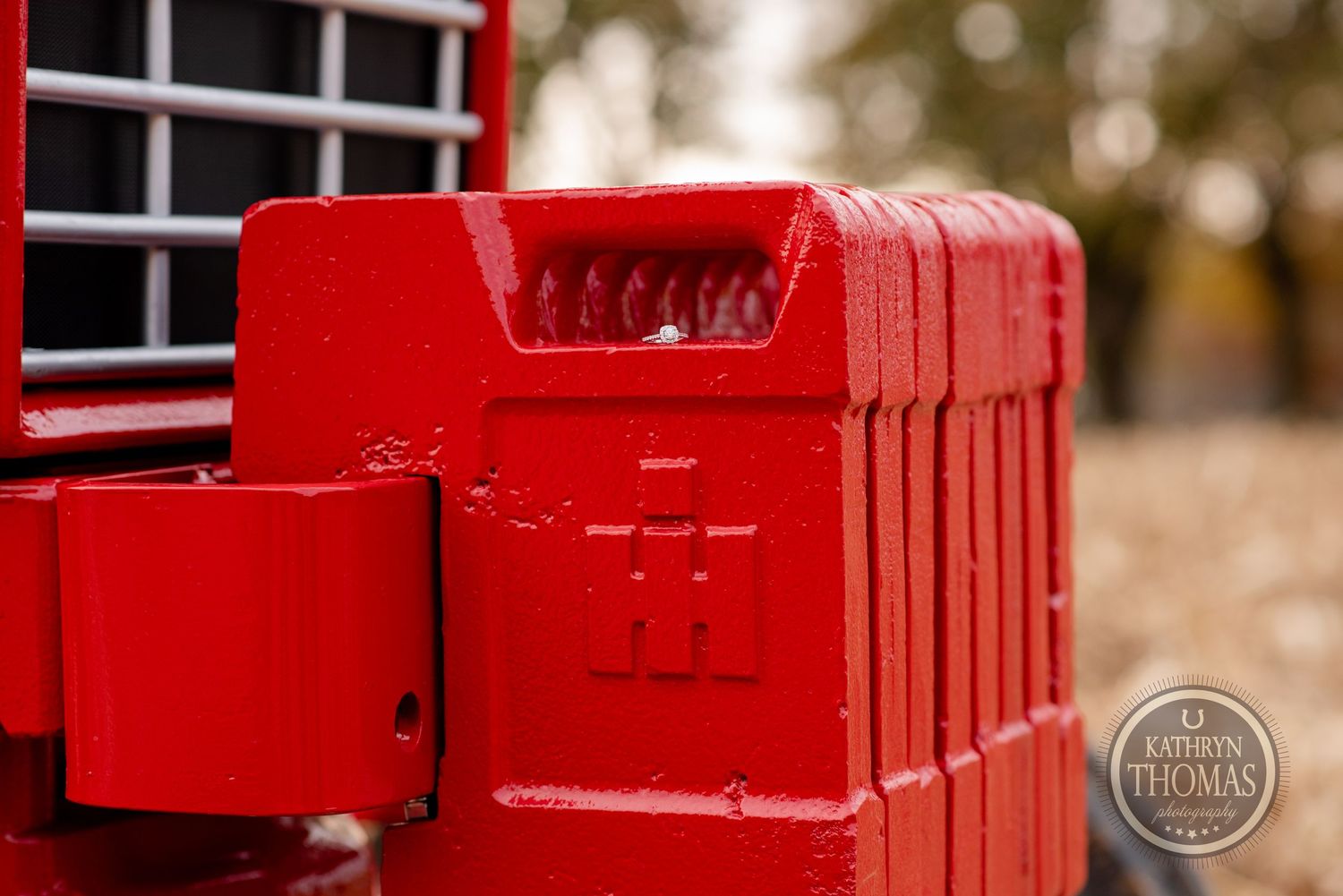 Close-up detail of bright red vintage tractor bodywork.