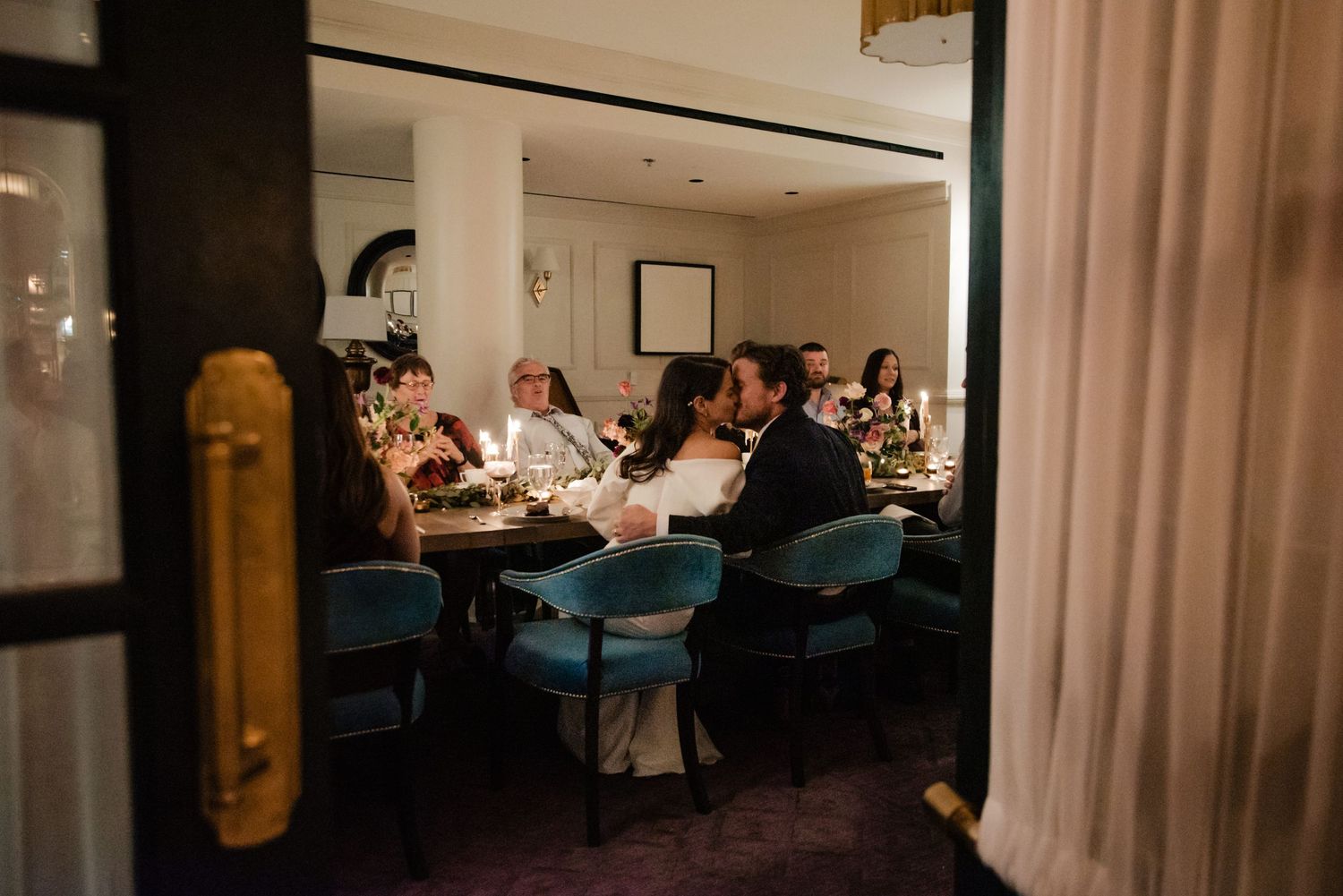 Warm-toned photograph of dinner guests enjoying a private dining experience.