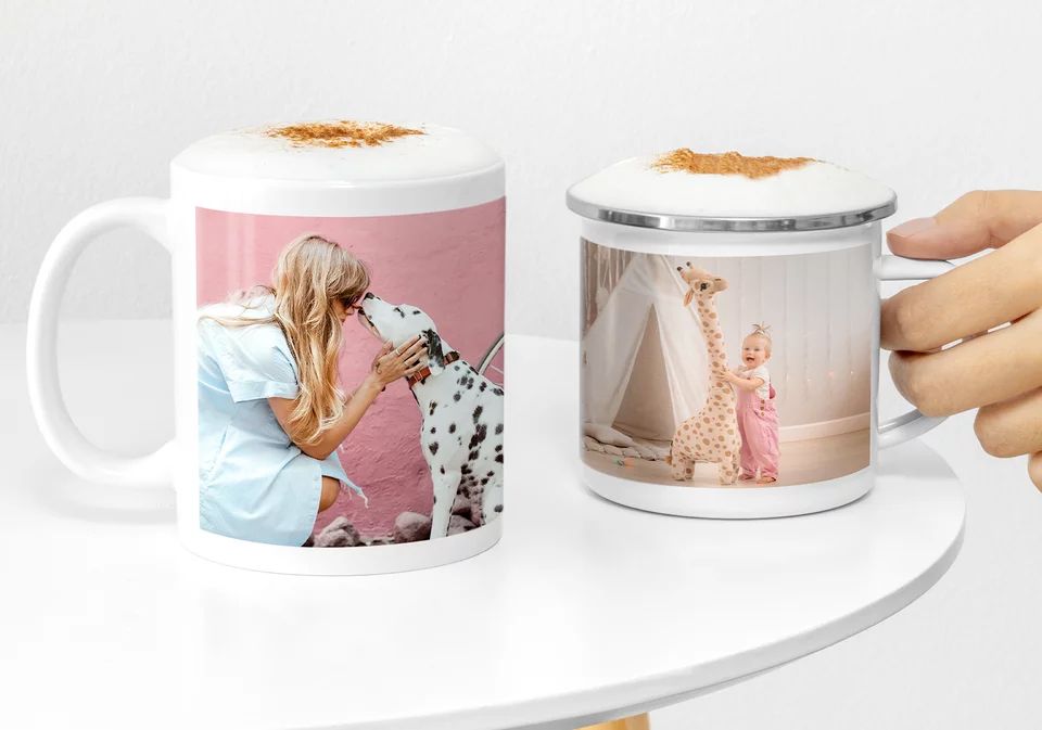 Custom photo mugs displayed on a white table showing personalized images of special moments.